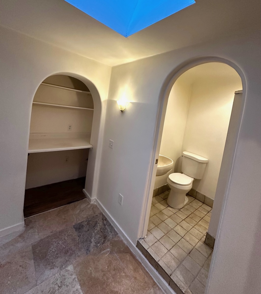 Full bathroom and built-in desk off the Bonus Room.  Skylight for natural light and ventilation.