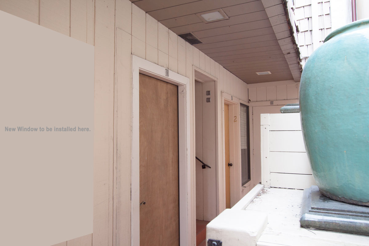 Front door with planned picture window addition for light and air.