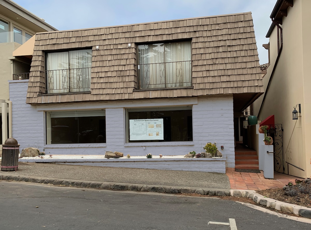 Lower-level entrance from sidewalk with 2-hour parking in front.