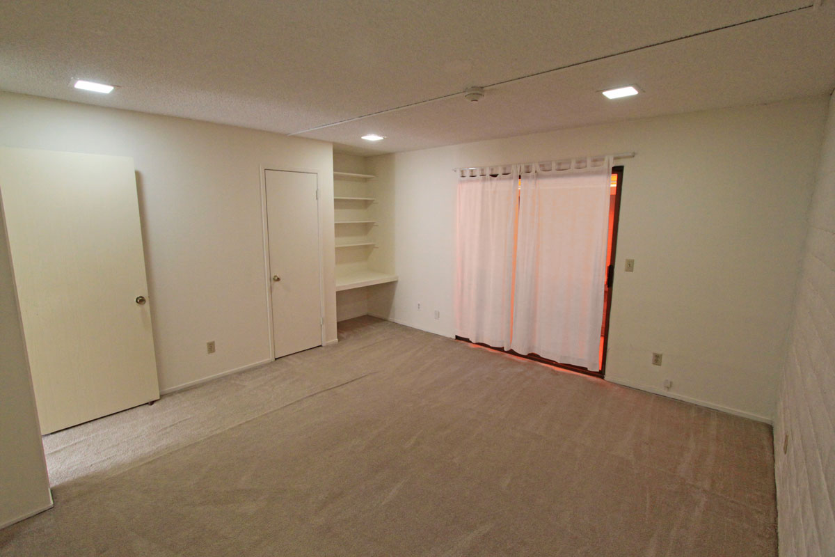 Bedroom ~14′ x 14′ with built-ins.