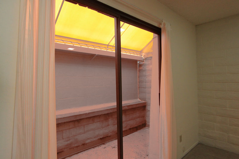 Covered back porch ~4′ x 10′.