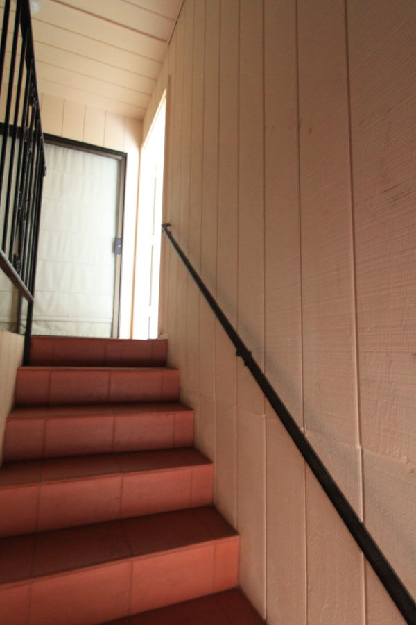 Stairs up; first door on right.