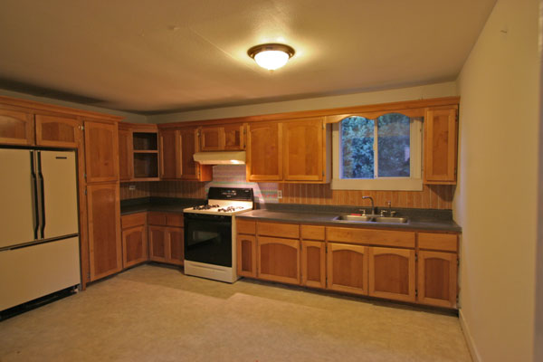 The large eat-in kitchen has plenty of storage space.