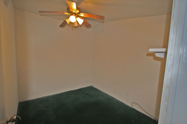 The 3rd bedroom is small and without a window or closet.  It would make a good computer or game room.