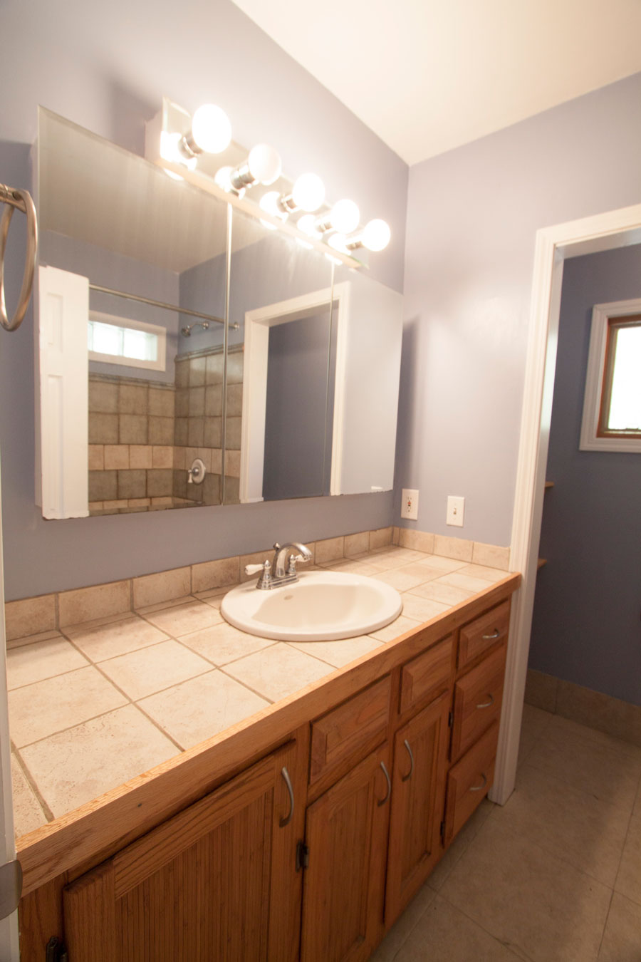 This spacious bathroom has plenty of storage.