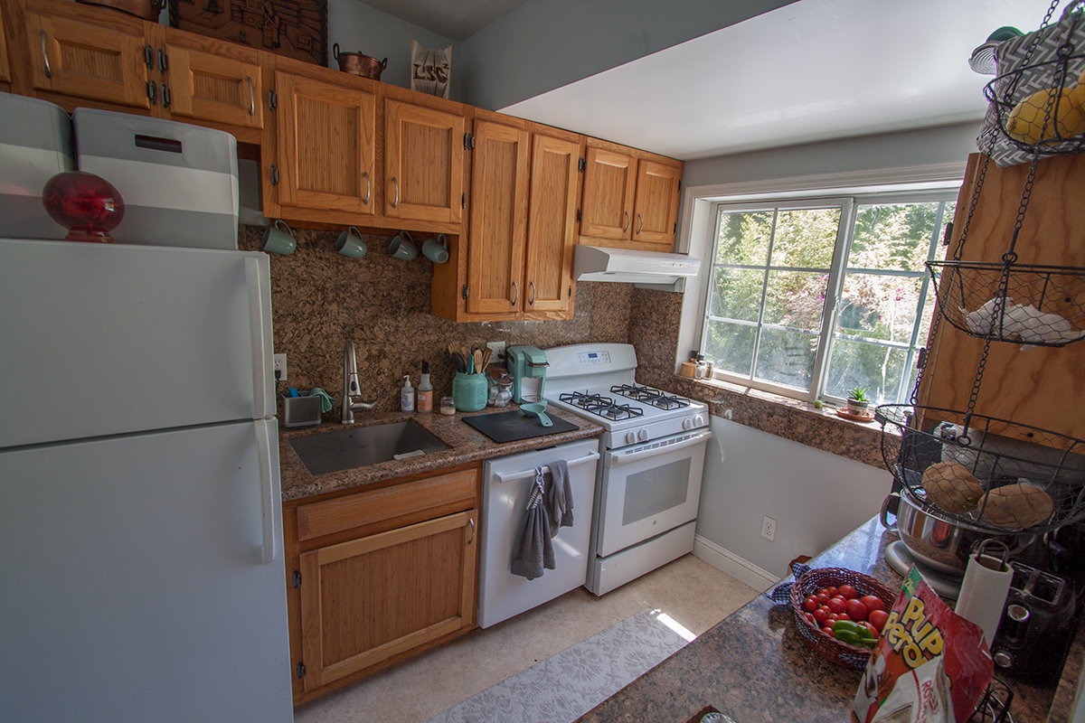 The excellent kitchen has an amazing view and is all new.  Custom oak cabinets, granite and plenty of work space.
