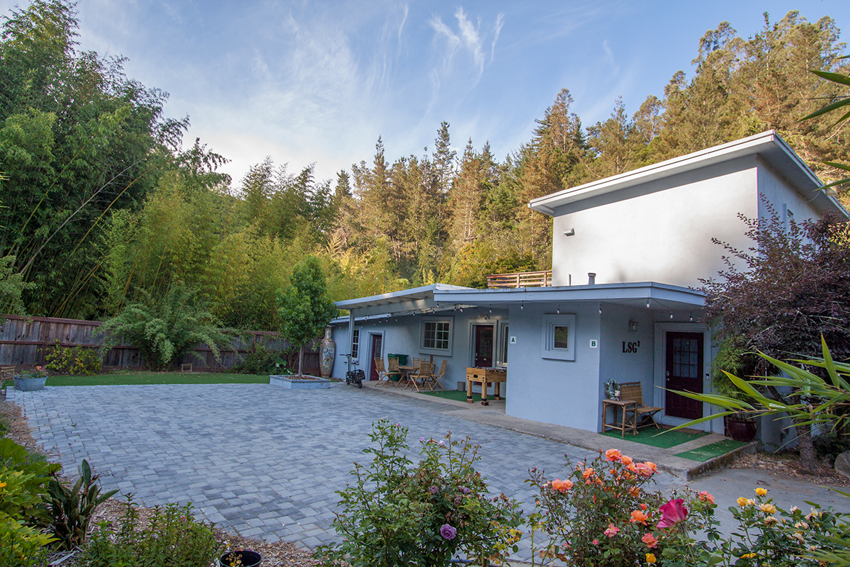 This two story apartment is nestled in the middle of an amazing bamboo garden.  Private parking in a gated facility is right outside your door.