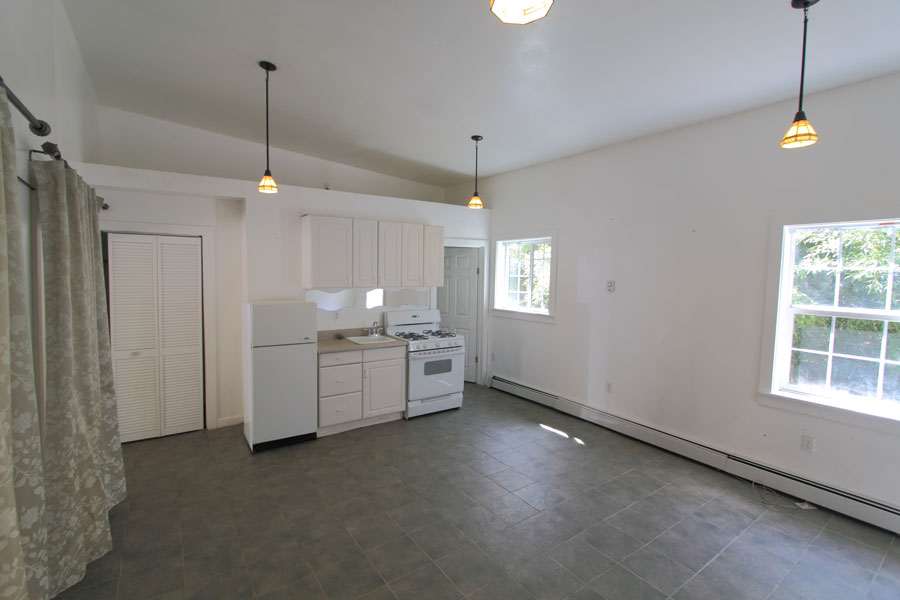 Studio is one large room (~15×17) including the kitchen; high ceilings for a spacious feel.