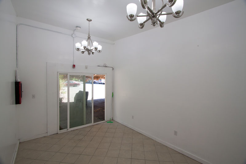 Bay 8 interior — bright end unit with tile floor.
