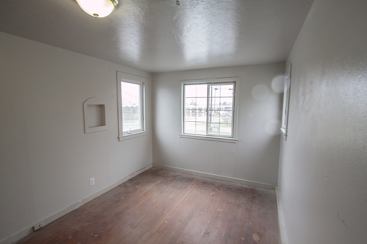 The upstairs bedroom is about 10' x 14' with a big closet.  New windows give great views in three directions.