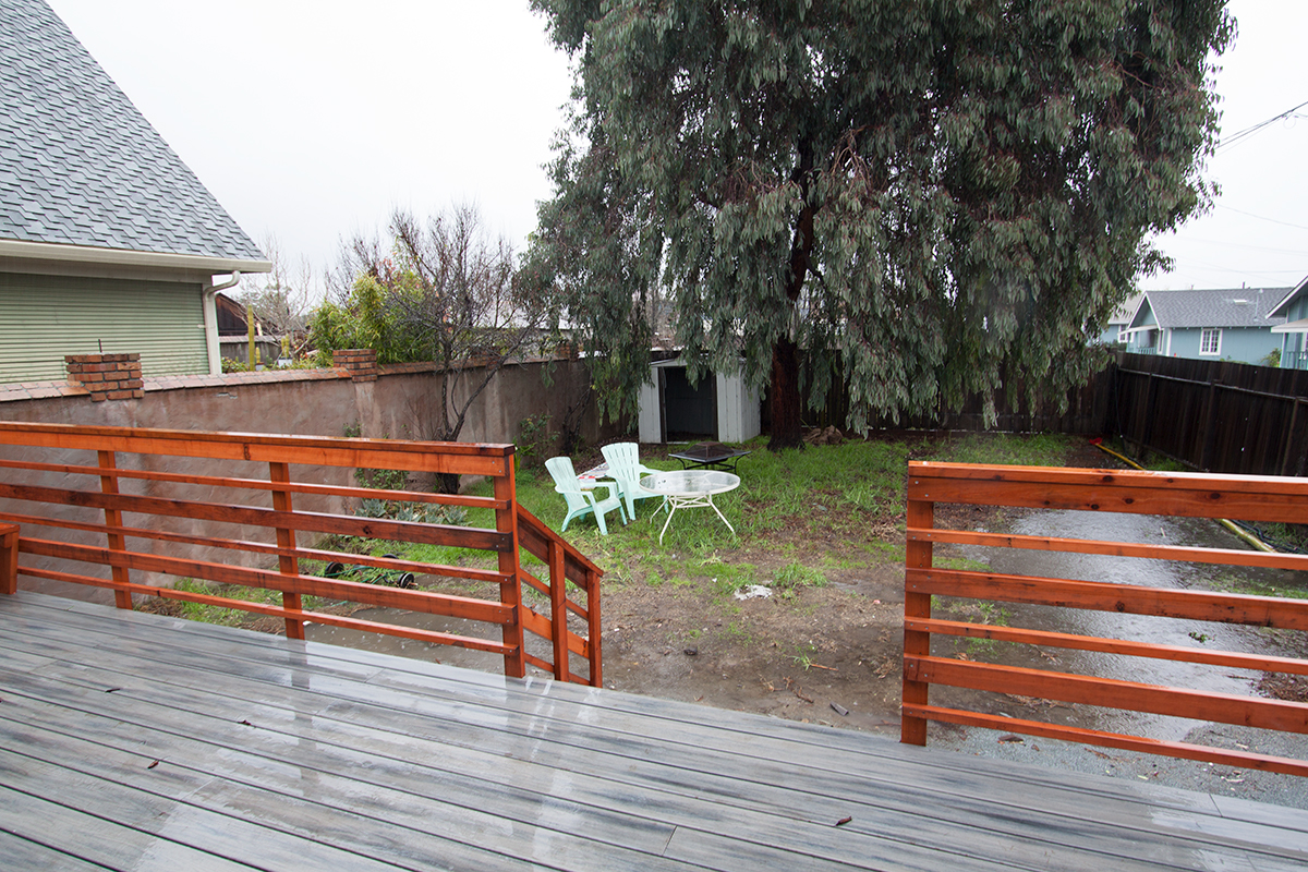 The back yard has lots of potential.  It is fenced, with a great tree and automatic drip for the bamboo hedge and rose garden.